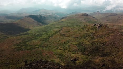 hikers at the sheer mountain peak during mount elgon trek in kenya - uganda, east africa. aerial drone shot