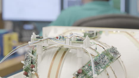 close up slider shot of intricate circuitry and circuit boards in a piece of medical equipment