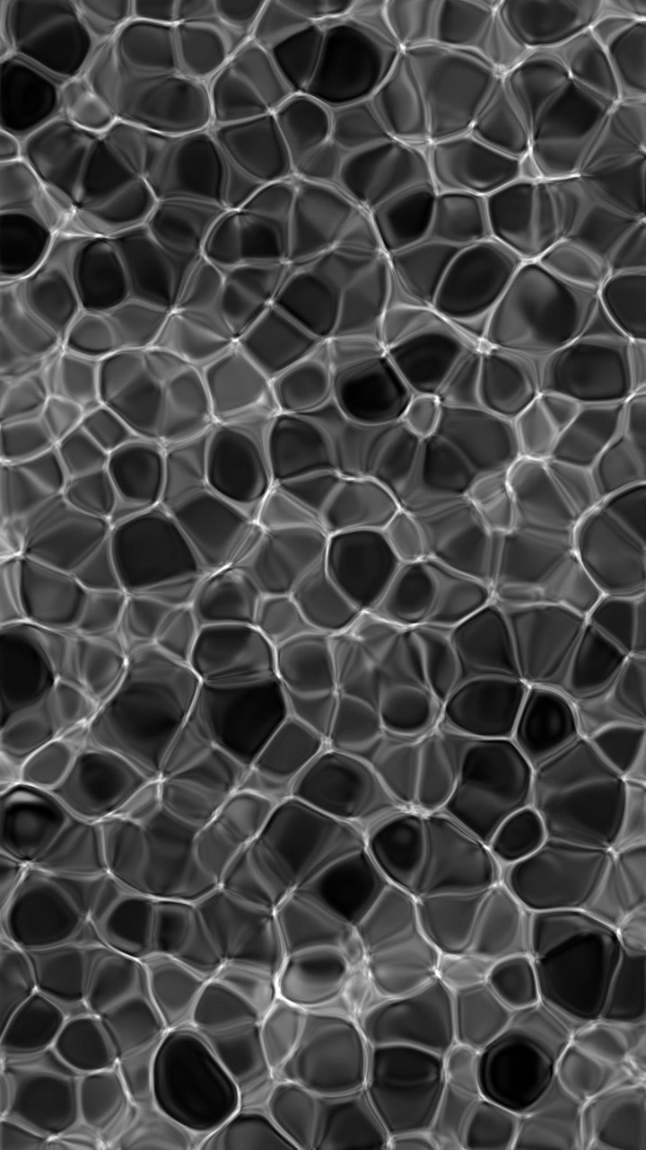 Video verticale di un motivo cellulare liquido molto denso in bianco e nero che fluttua, in loop continuo
