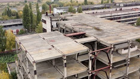 ruined buildings. industrial constructions without windows on abandoned plant. old manufacture. circling view.