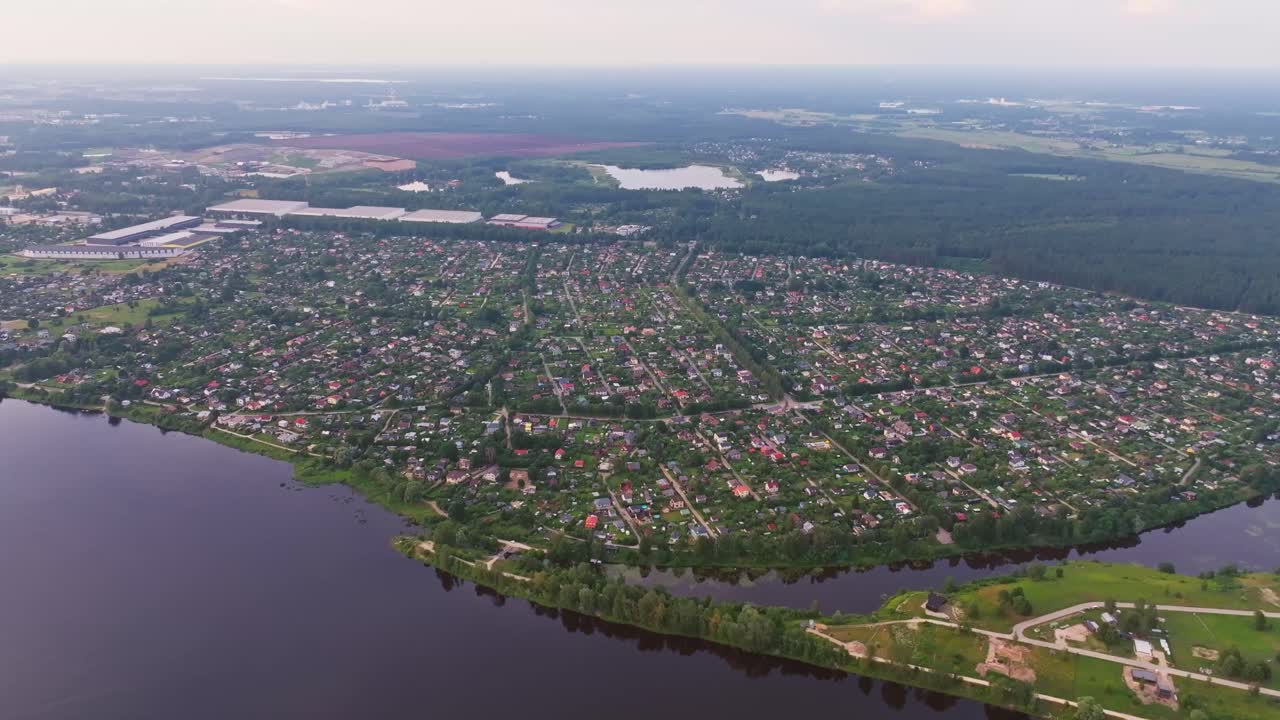 Expansive aerial reveals Dārziņi neighborhood on Riga southeast edge by Daugava