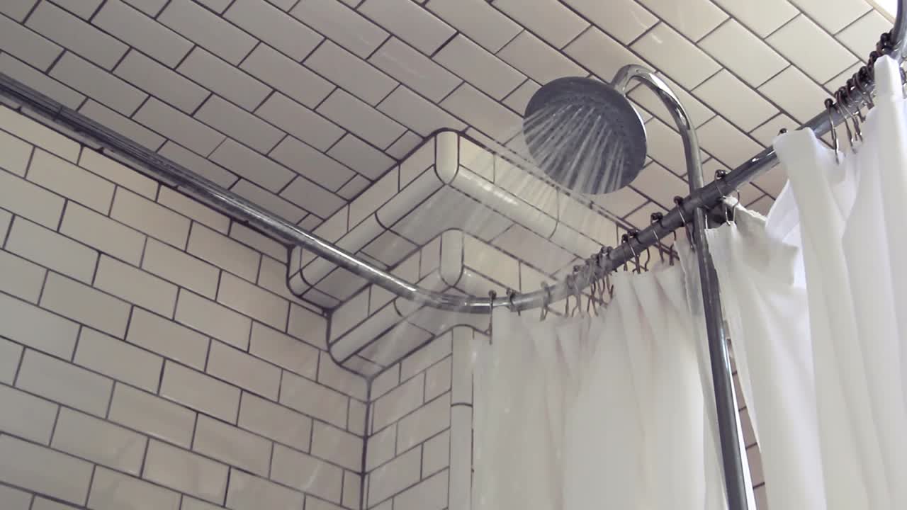 Shower turns on in an old fashioned bathroom