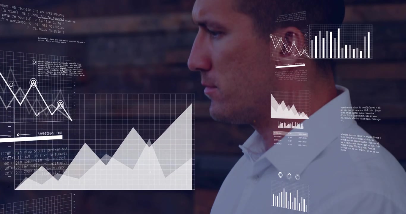 Man typing on keyboard and creating business charts expanding over monitor while analyzing data