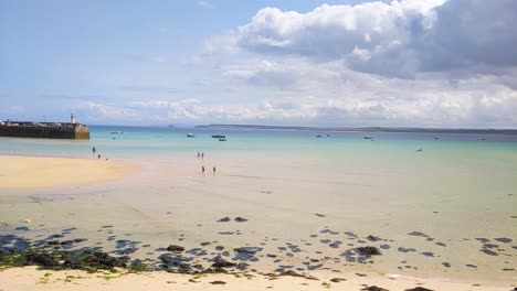 beautiful slow motion view of st ives beach in summer with dramatic clouds