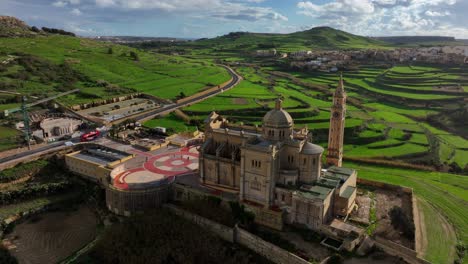 aerial view of ta pinu church with green landscape on a sunny day in gozo island, malta