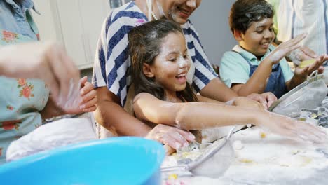 Family-preparing-cookies-in-the-kitchen-4K-4k