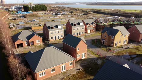 unfinished waterfront townhouse property development construction site aerial view over rooftops