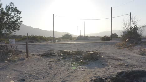 aerial push over dirt and street in the desert