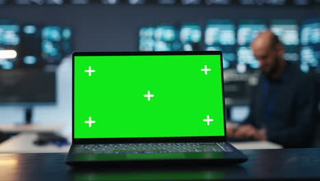 close up shot of chroma key notebook used by specialist in data center