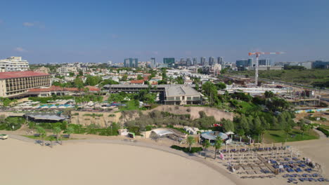 acadia hotel on south herzliya beach - there are restaurants on the beach but is empty of visitors, it right next to the marina and includes accessible paths leading all the way to the waterline