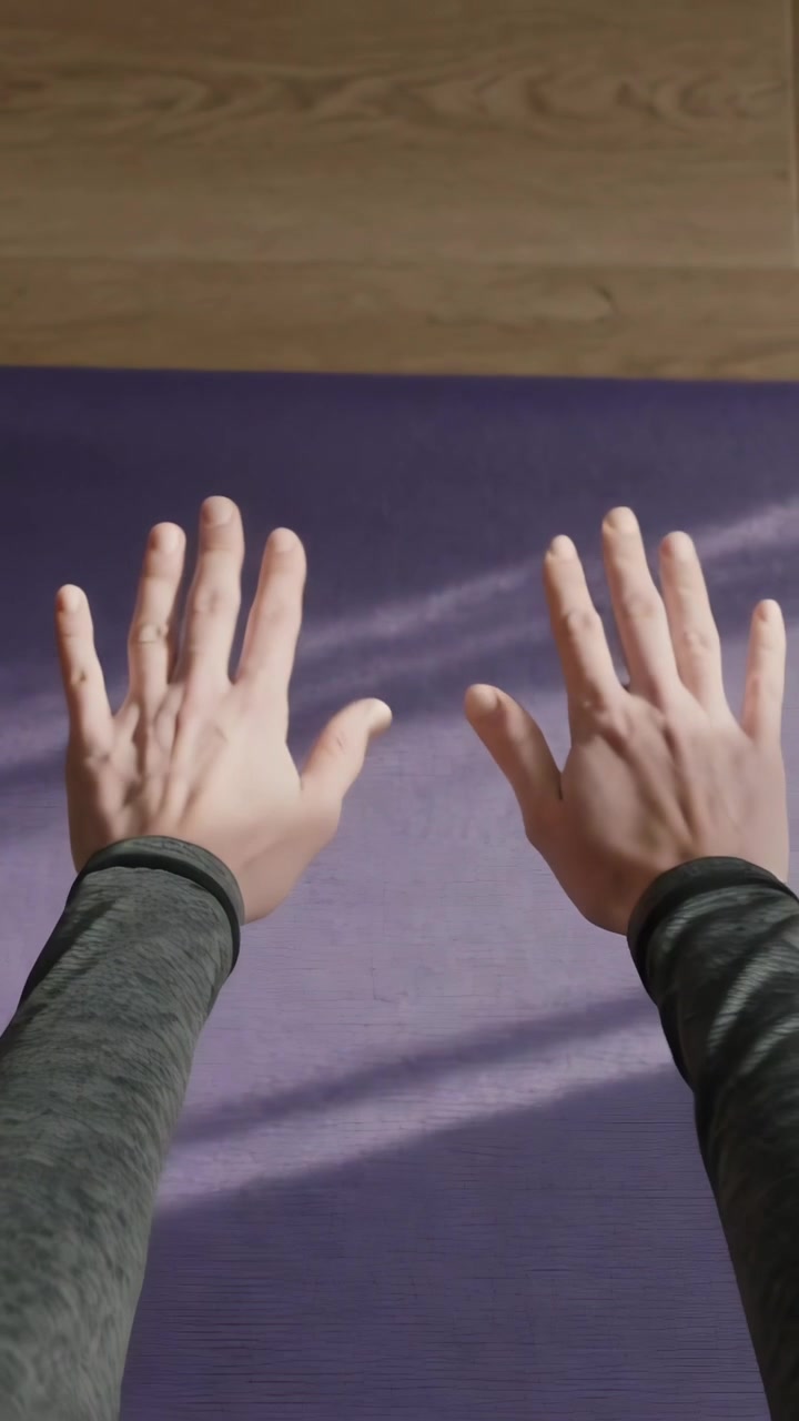 Vertical video: Placing palms of person in gray long sleeves near purple mat at home, starting yoga