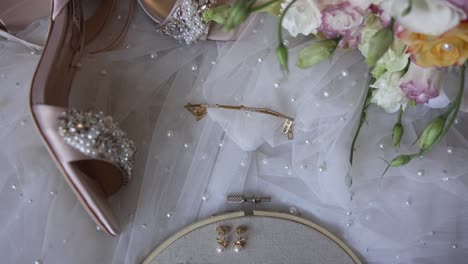 bridal accessories and flowers with embroidered initials on veil