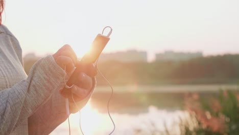 woman choosing the best song for jogging