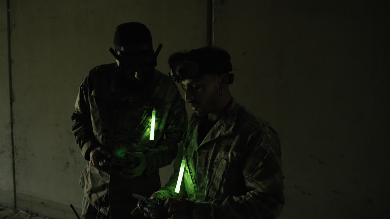 Two Military Pilots Soldiers Prepare to Fly Their War Drones