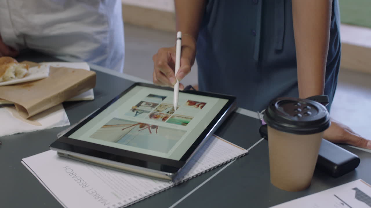 business women designers meeting brainstorming together team leader woman sharing creative ideas designing using tablet technology in modern office workplace