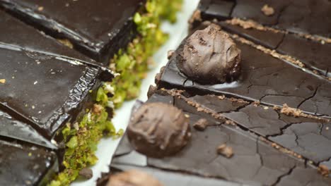 close-up of slices of chocolate cake with truffles