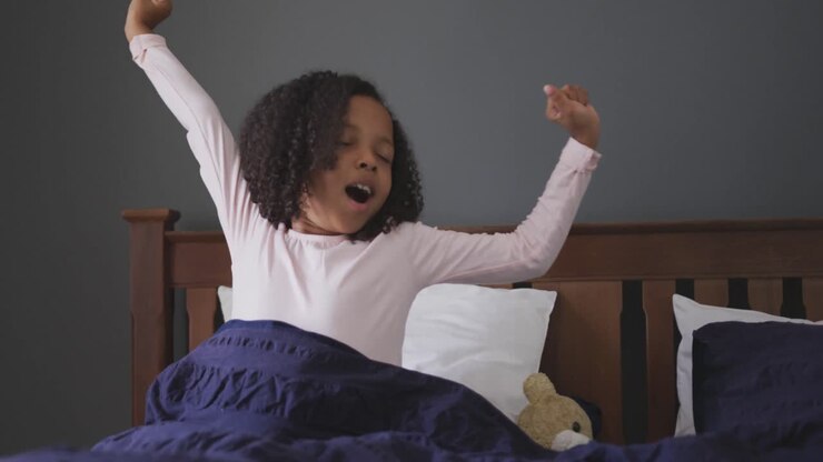 African american girl waking up and yawning