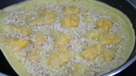 apam balik or malaysian peanut pancake turnover.  flour pancake stuffed with sugar and corn topping. cooked using the hot pan. famous street food in malaysia