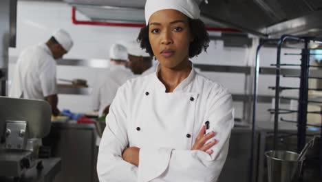 Portrait-of-african-american-female-chef-with-arms-crossed-looking-at-camera