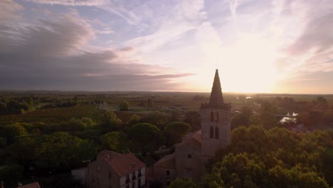 aerial: the church of béziers with the farm fields in the distance