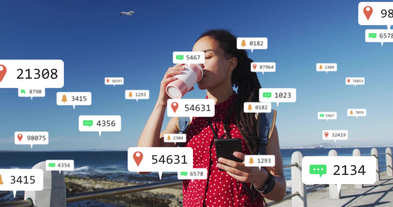 Woman holding phone and coffee, phone receiving social pings crowding hands, showing overload