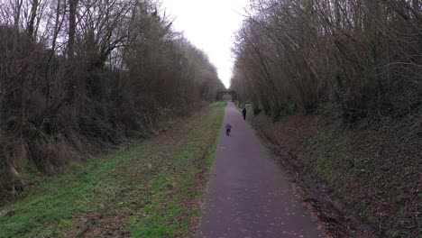 a little boy bicycling on the greenway of normandy