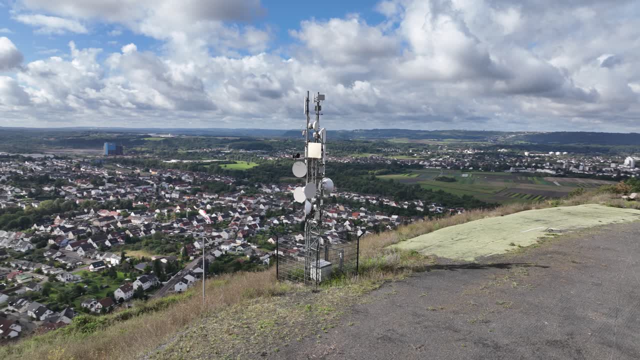 Cell Tower on Hilltop Overlooking Rural Landscape