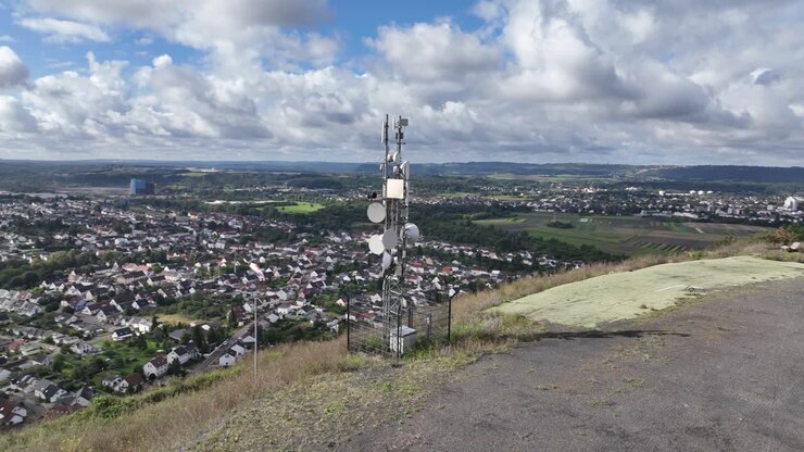 Cell Tower on Hilltop Overlooking Rural Landscape