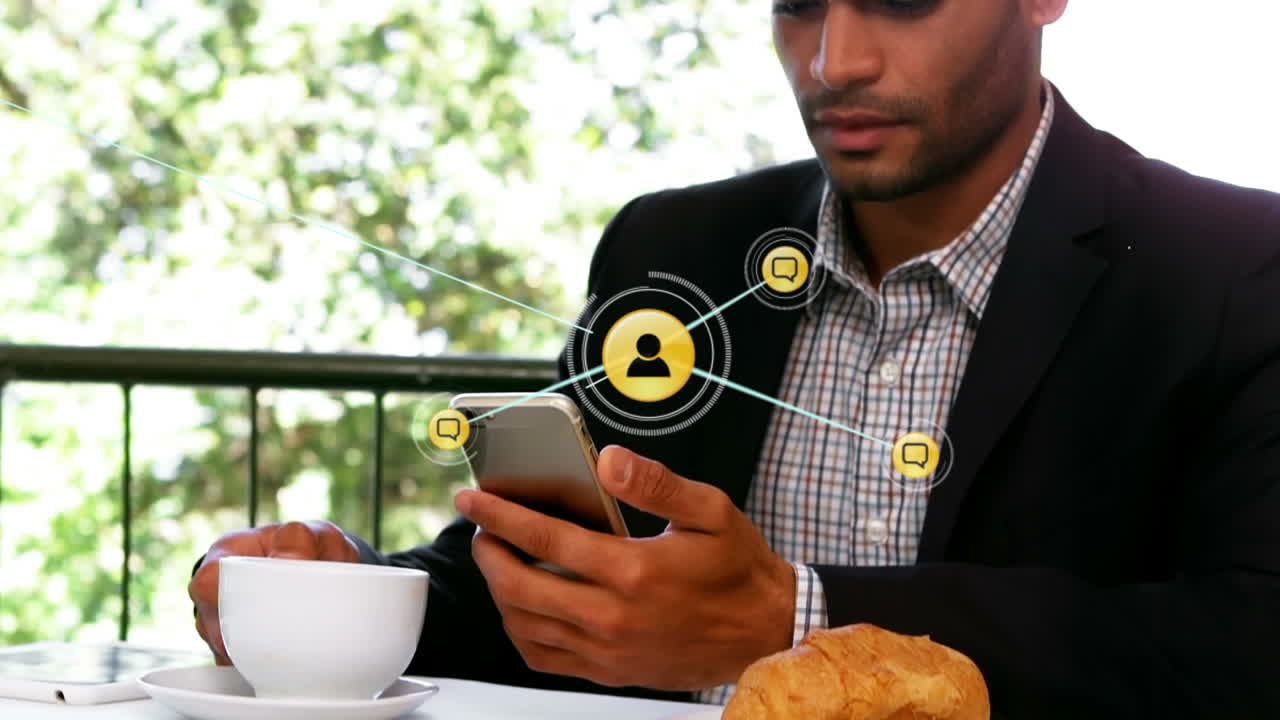 Animation of network of digital icons over biracial businessman using smartphone at a cafe
