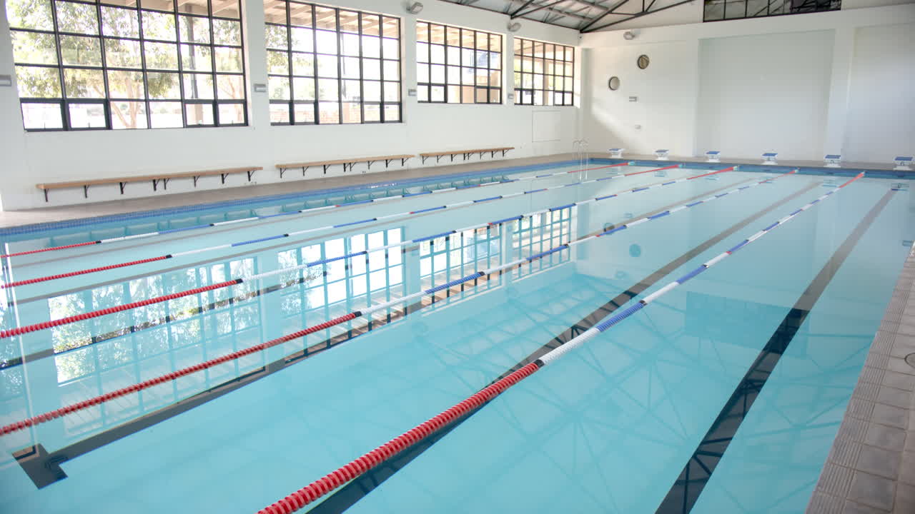 Indoor swimming pool with lane dividers, ready for competitive swimmers training, copy space