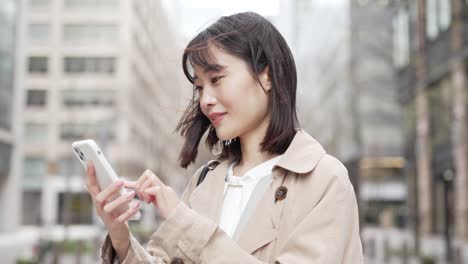 a woman operating a mobile device