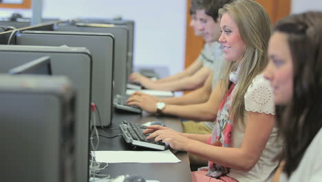 student sitting at the computer and smiling