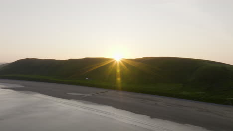 sunset over a coastal mountain range