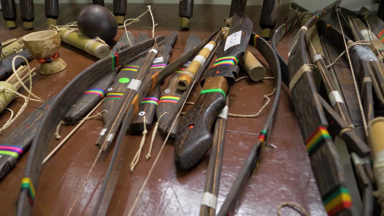 Take in the intricate beauty of Chonta craftsmanship with this panning video showcasing meticulously designed arrows, knives, and spears