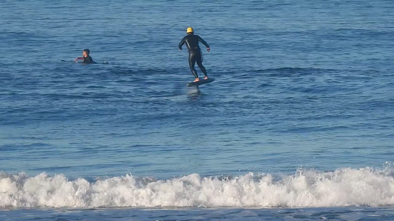 Man Riding an eFoil on the Ocean