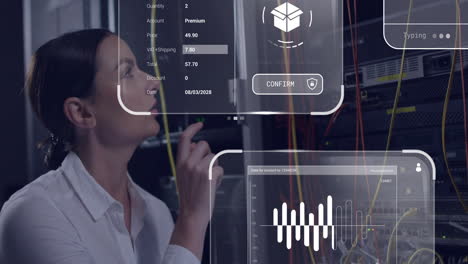 interacting with digital interface, businesswoman analyzing data and graphs in server room