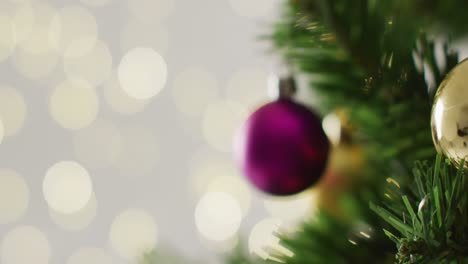 Closeup-of-christmas-balls-and-decorations-on-the-green-christmas-tree