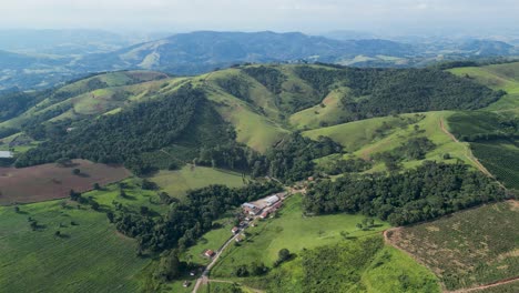 aerial view of lush green rolling hills and farmland in brazil