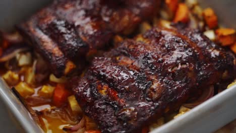 Crop-cook-smearing-sauce-on-ribs