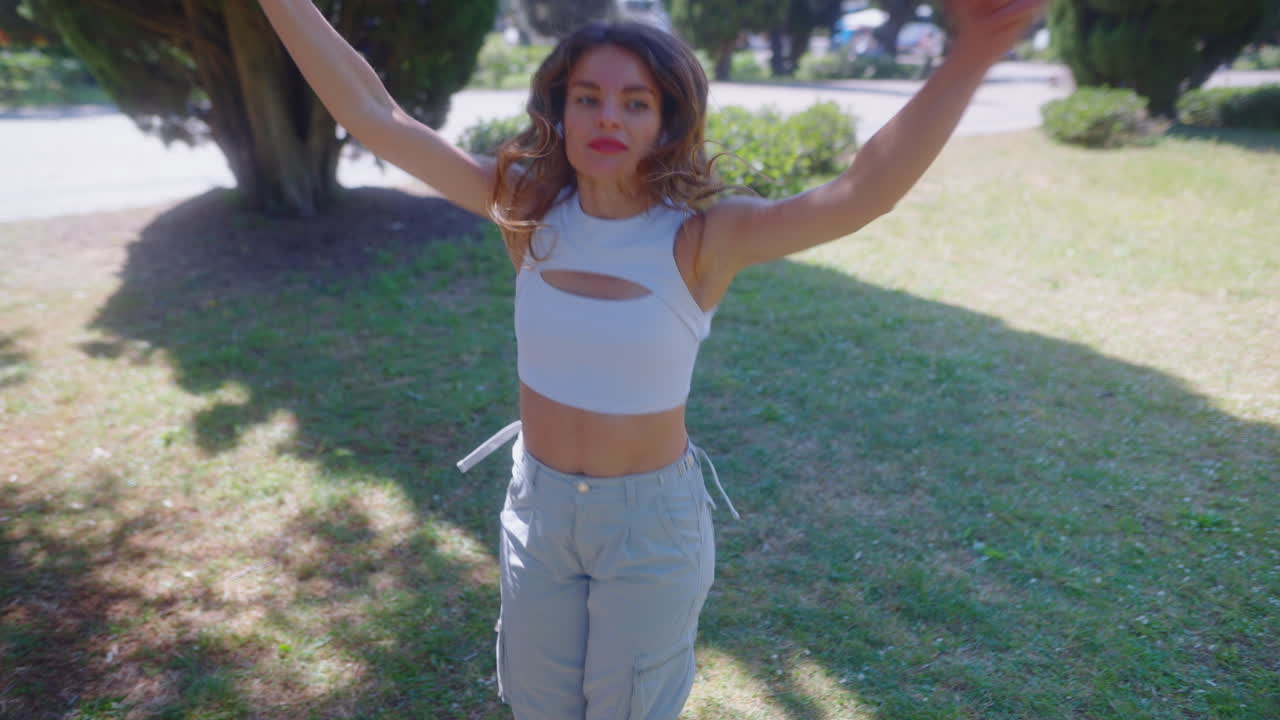 Woman dancing in a park