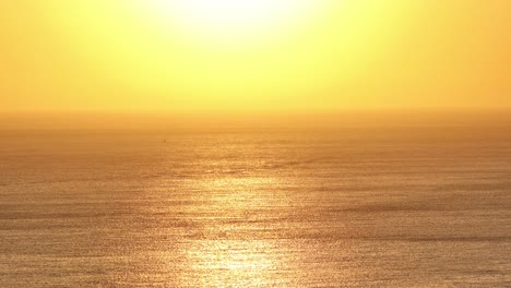 Sunset-over-a-calm-sea-reflecting-the-reflection-of-the-surface