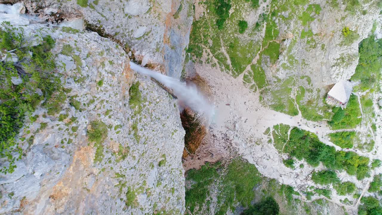 Dramatic aerial rising drone view of famous and tallest Rinka waterfalls, Slovenia