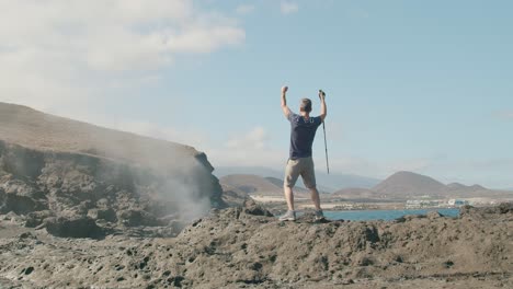 male traveler walking near blowhole