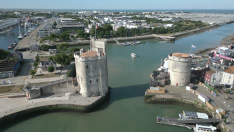 la rochelle port with chain and saint nicolas towers, france