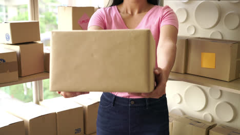 asian woman with delivery package