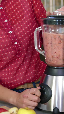Couple making smoothies