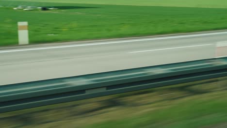 view from the window of a fast-traveling bus. wide freeway