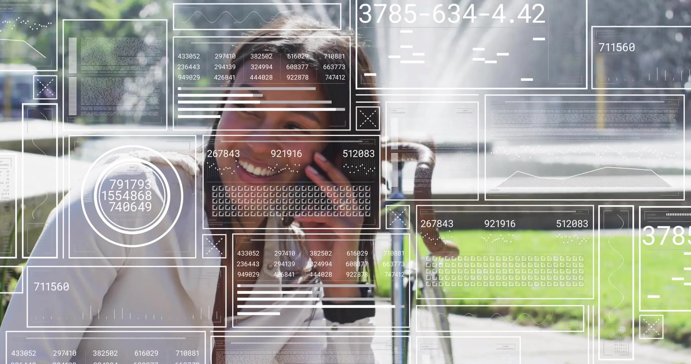 Mid adult woman placing smartphone call and viewing animated data overlays in technology demo