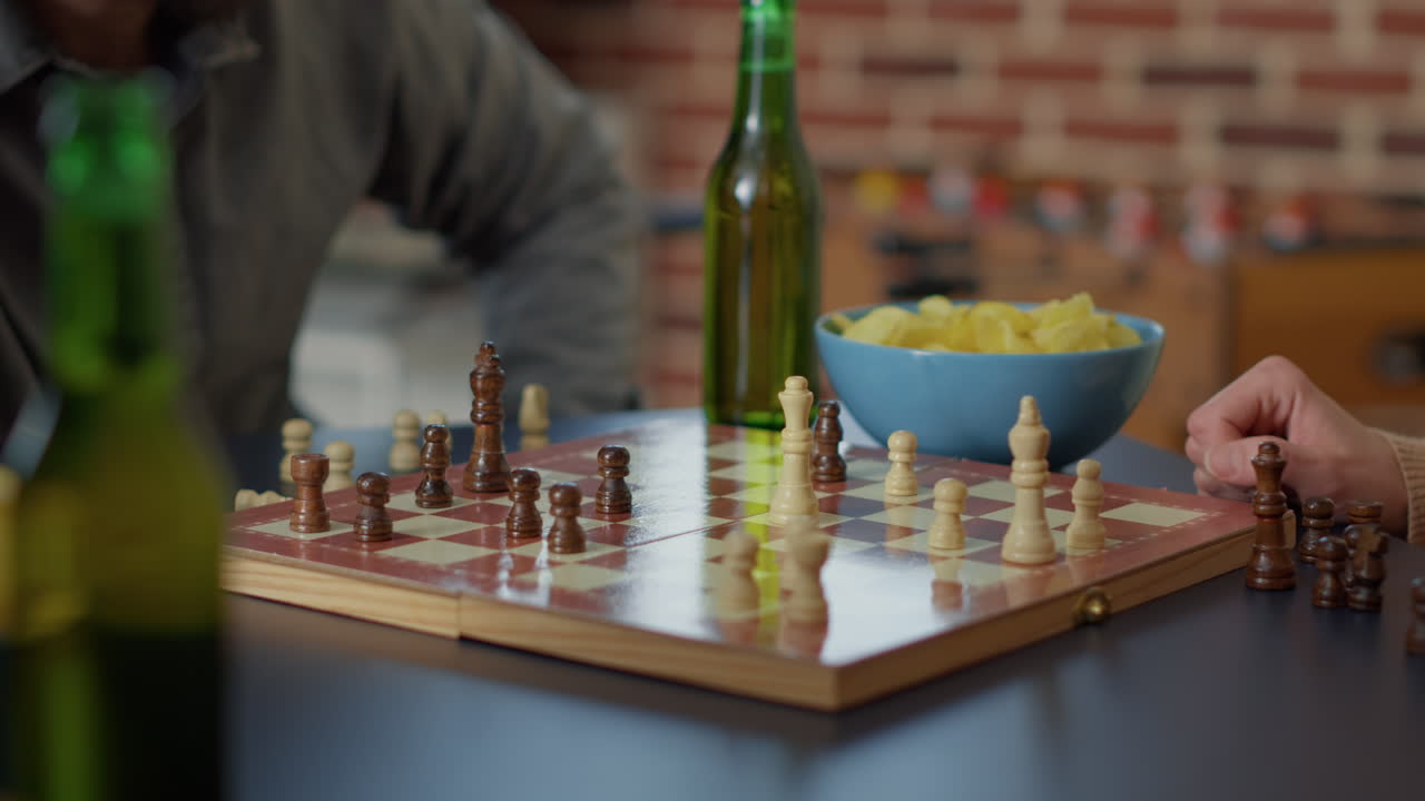 Young people having fun with chess board games play