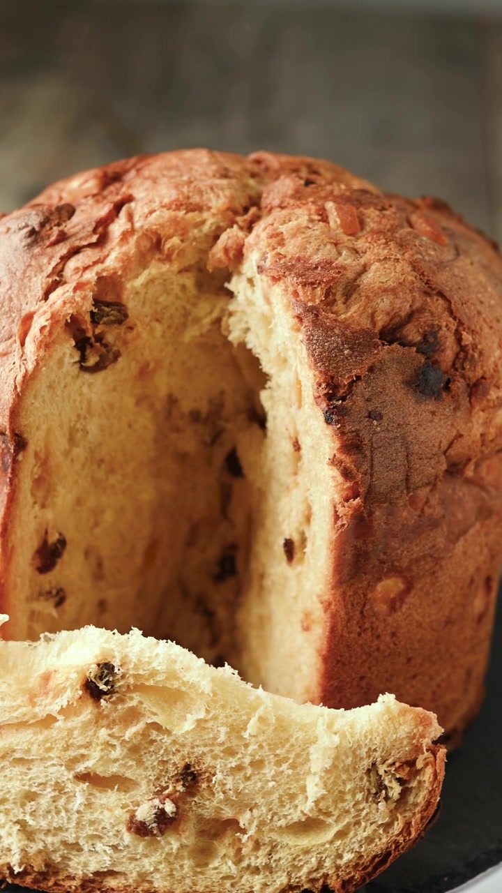 Cutting traditional Italian Panettone for christmas